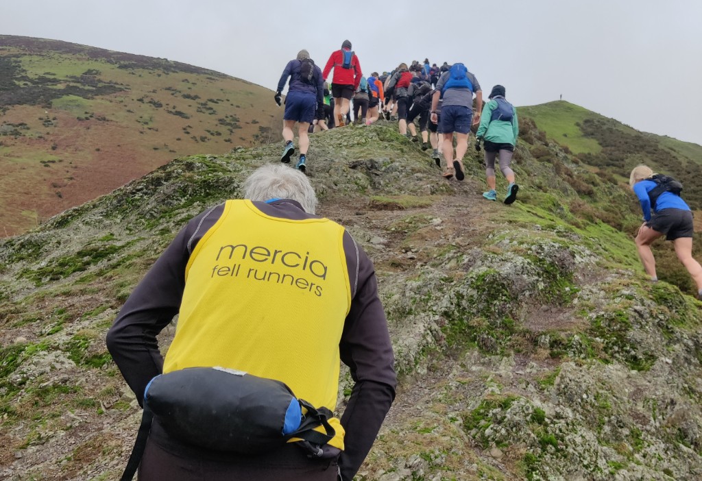 Mercia Fell Runners members on a training run up a rocky fell